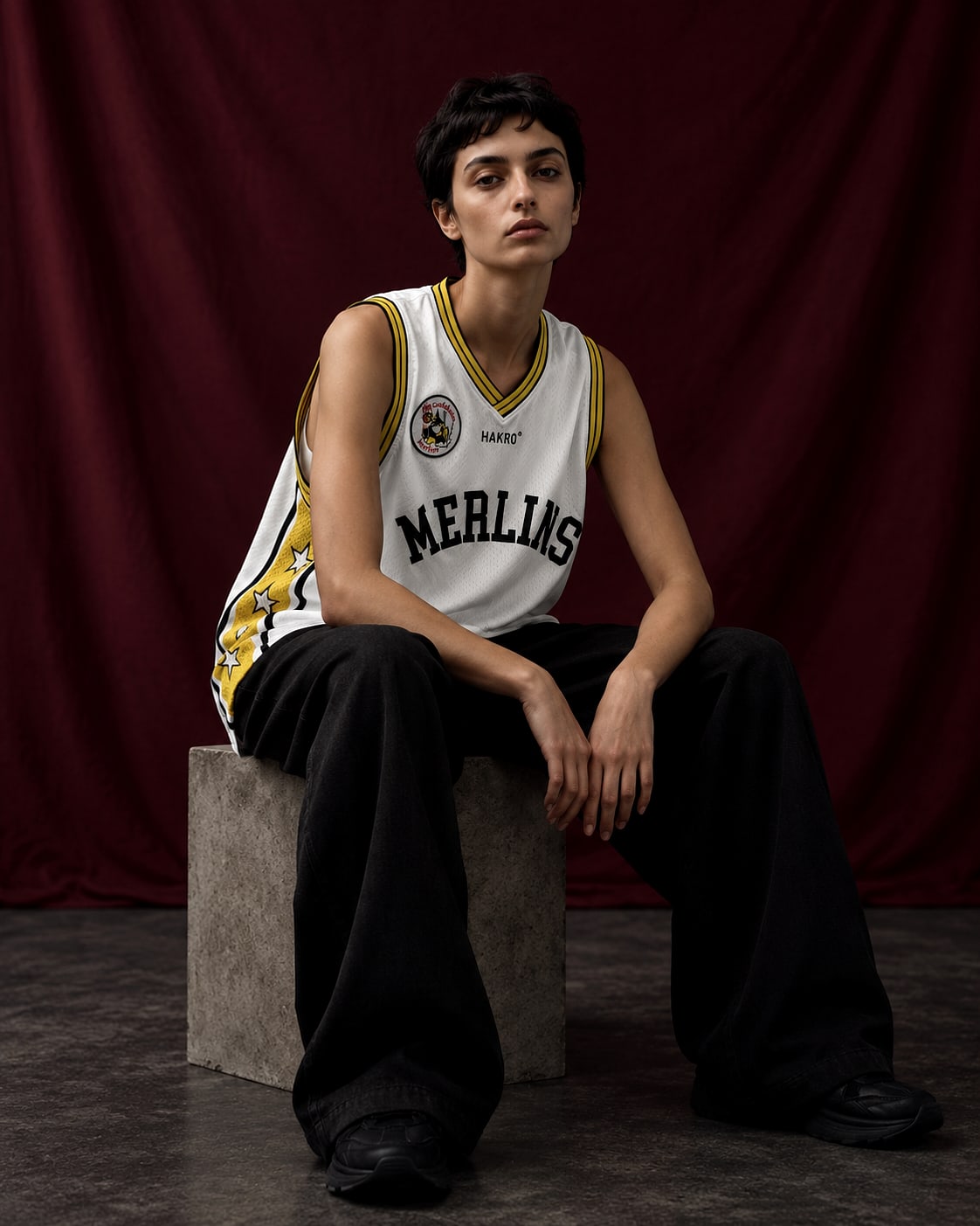 Model wearing the basketball singlet from a delivered club lifestyle capsule